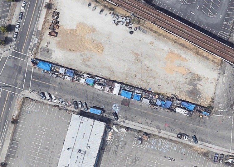 Figure 2. An aerial view of the Fifth Street encampment, including Castle and its neighbors arranged in a strip stretching from West Mandela Parkway (upper left) to Kirkham Street (lower right). Screenshot from Google Earth.