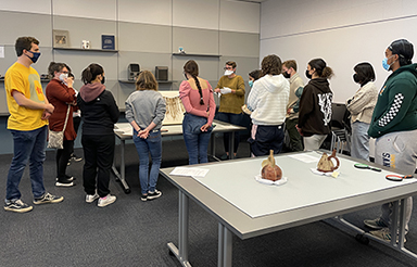 The IRC Center for Object-Based Research and Learning (COBRAL) with students from Dr. Alicia Boswell's 137RS course studying objects from UCSB's Art, Design & Architecture Museum.