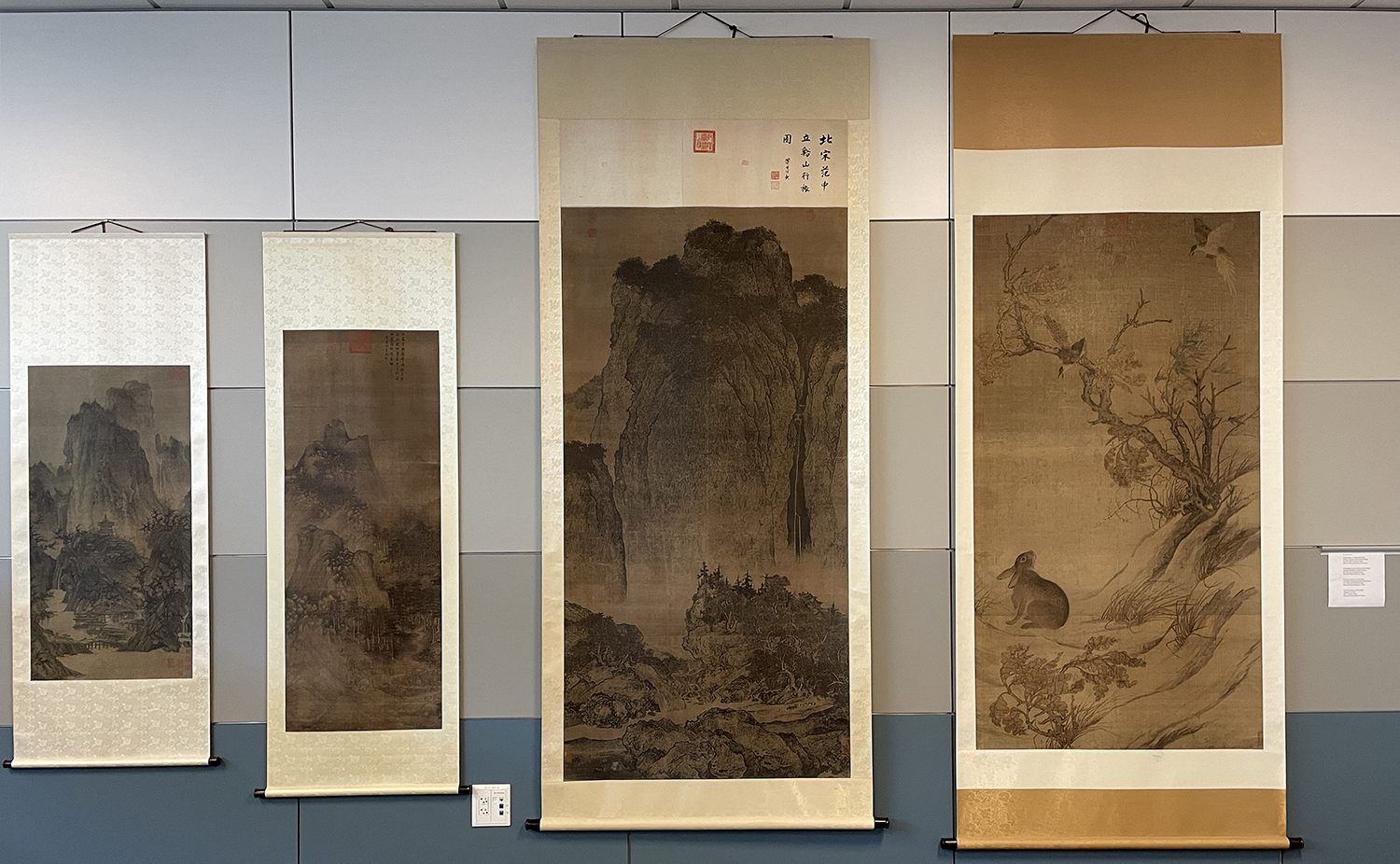 Four Chinese scrolls hanging on a wall in the Center for Object-Based Research and Learning (COBRAL), located in the Image Rseource Center