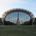 A reflection of the Eiffel Tower in the west facade of the Grand Palais Éphémère