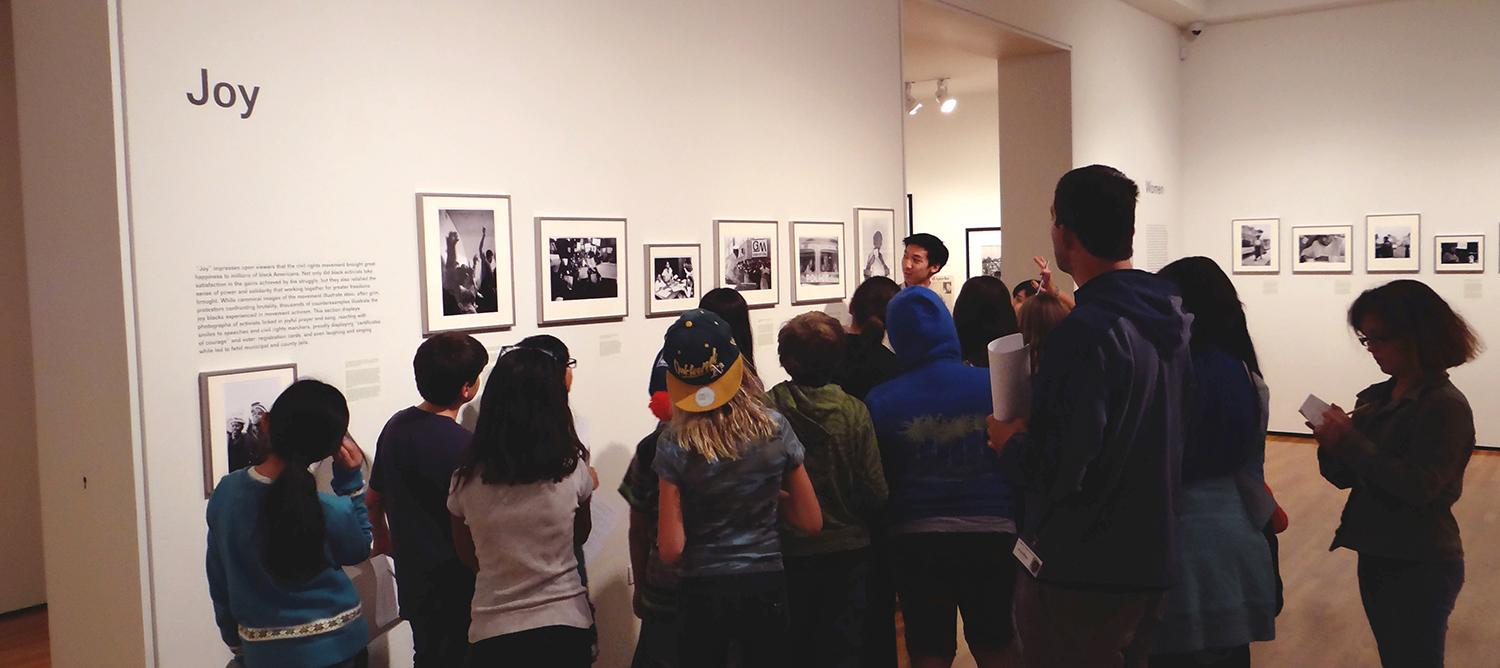 Art, Design & Architecture Museum interns lead a middle school tour of "Freedom Now! Forgotten Photographs of the Civil Rights Struggle" on view, October 19 - December 13, 2013 (courtesy Art, Design & Architecture Museum)